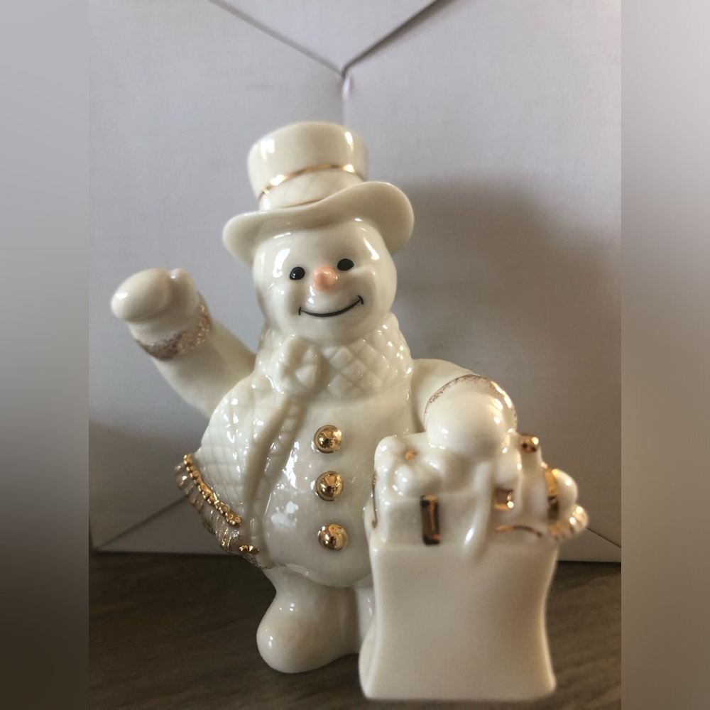 Lenox Snowman Ornament holding bag with gifts